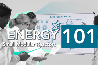 scientists around a white board with a diagram of a small modular reactor