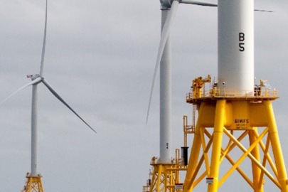 Offshore wind turbines at sea.