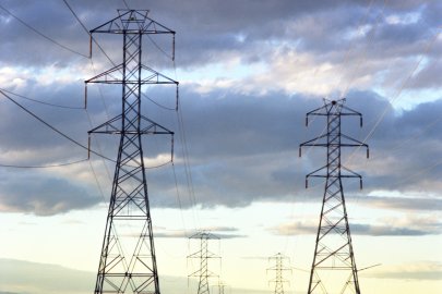 Power lines in front of a sunset.