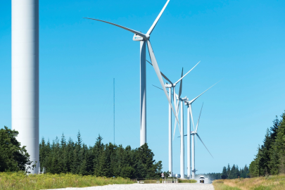 Wind turbines against a cloudless sky.