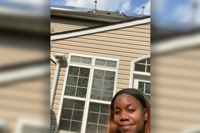 Selfie of Lakisha Harris with her rooftop solar system