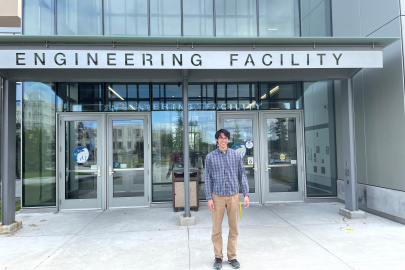 Photo of Logan Borger standing outside the UAF Engineering Building