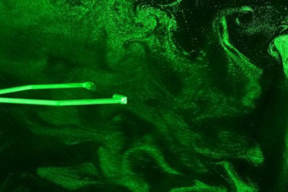 A sonic temperature sensor and cloud droplets in the laser sheet inside Michigan Tech's cloud chamber.