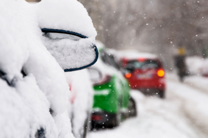 Cars in snow along the side of the road