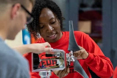 Students examining wind energy technology designs
