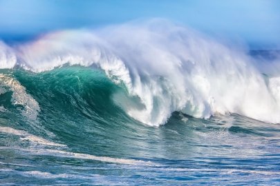 Ocean waves roll in the ocean.