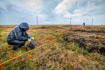 Taking measurements at the Barrow Environmental Observatory, 330 miles north of the Arctic Circle for the Next-Generation Ecosystem Experiment (NGEE-Arctic). The project seeks to improve climate model predictions by studying Arctic terrestrial ecosystems.
