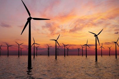 Offshore wind farm at sunset.