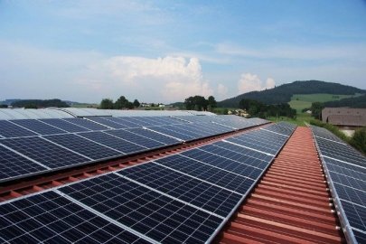 Rows of solar panels on a rooftop.