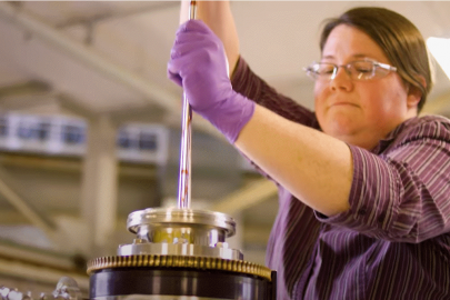 Young woman works with scientific equipment