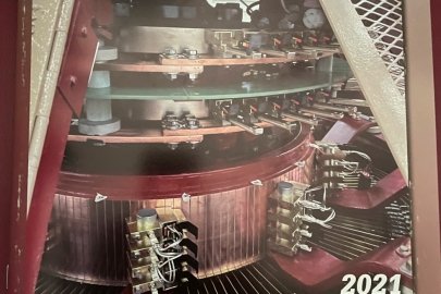 A peek inside of Wolf Creek hydroelectric Generator 5 top dome revels the bright brass electrical connections
