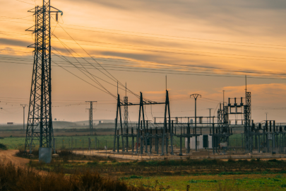 Transmission lines and a transformer station at sunset