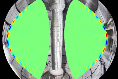 The structure of a plasma instability as calculated using a numerical simulation, shown inside a photo of the National Spherical Torus Experiment. This plasma instability is associated with explosive energy bursts that can damage the reactor vessel.