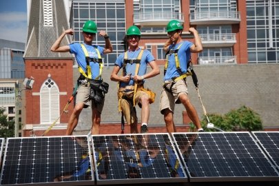 Three solar installers complete a PV system installation for Charlotte Habitat For Humanity at the Democratic National Convention 2012.