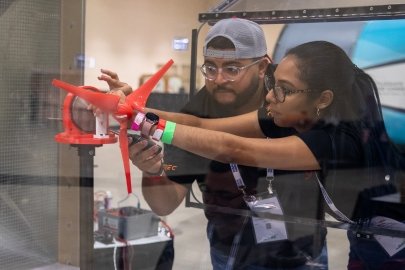 Two CWC participants set up a model turbine. 