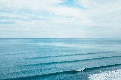 Ocean waves roll in the ocean.