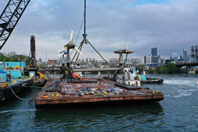 Photo of a tidal energy device on a dock platform. 