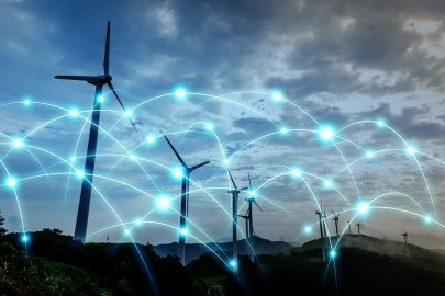 Wind turbines with glowing dots superimposed over them. 