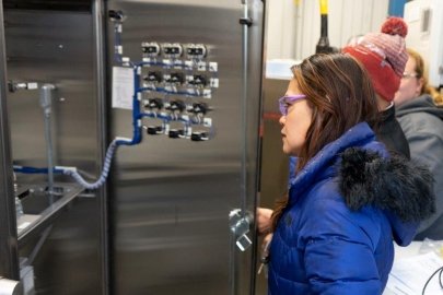 EM contractor Washington River Protection Solutions Engineer Elvie Brown examines equipment at the Plutonium Uranium Extraction Plant to learn more about the stack sampling program, as site contractors prepare for the start of tank-waste treatment under the Direct-Feed Low-Activity Waste Program.