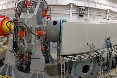 A semitruck-sized piece of equipment within a laboratory.
