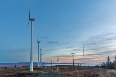 Several wind turbines at twilight in remote Alaska.
