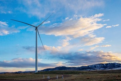 Wind turbine against a sunset.