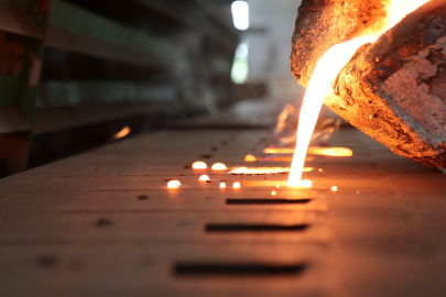 molten metal being poured into a cast