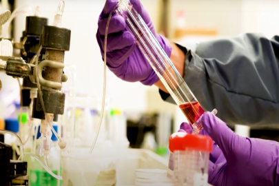 Image of a person adjusting lab equipment