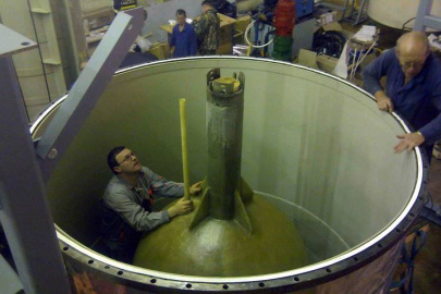 The BEST apparatus under construction. This image shows the inner tank, with a BEST researcher standing in the outer tank.