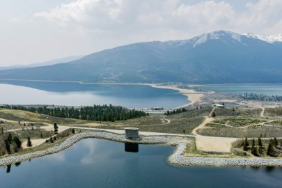 A pumped storage hydropower facility, with mountains in the distance
