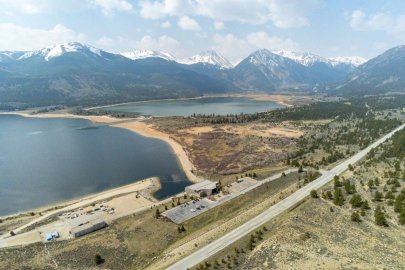 A pumped storage hydropower facility, with mountains in the distance