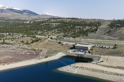 A pumped storage hydropower facility, with mountains in the distance