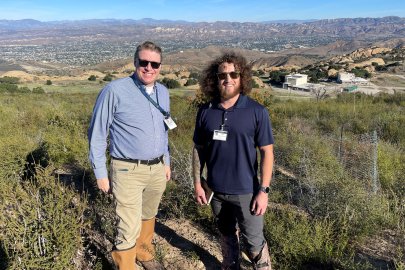 Two men standing in front of an overlook of theEnergy Technology Engineering Center’s (ETEC) portion of the Santa Susana Field Laboratory 