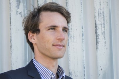 A headshot of Marcus Lehmann looking into the distance.