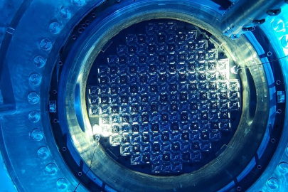 Photo inside Vogtle Unit 3 reactor at criticality, emitting a blue glow.