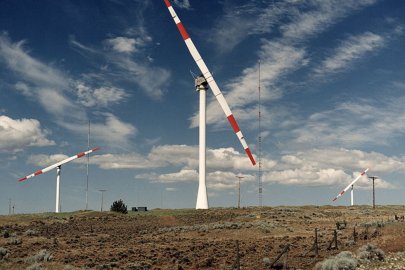 An early wind turbine prototype in an agricultural field.
