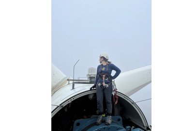 Annika Torp standing on turbine rotor, looking away from camera