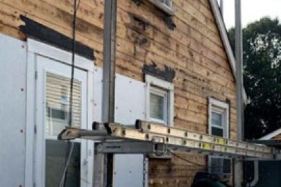 The side of a house getting re-sided