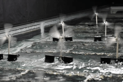 Floating offshore windfarm experiments in a facility