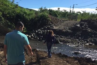 Two people walking near stream in Puerto Rico