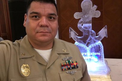 A person in a military uniform looking at the camera.