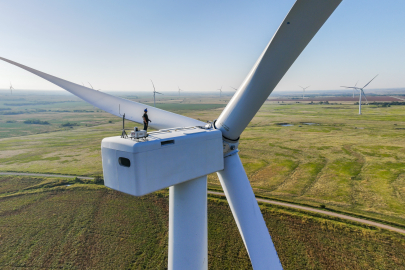 Worker on top of wind turbine