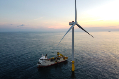  A wind turbine installation vessel beside a 6-megawatt turbine
