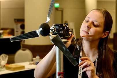 Person working on a wind turbine model