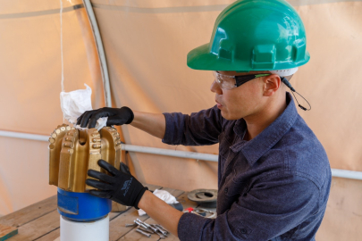 Sandia staff member works with a PDC drill bit