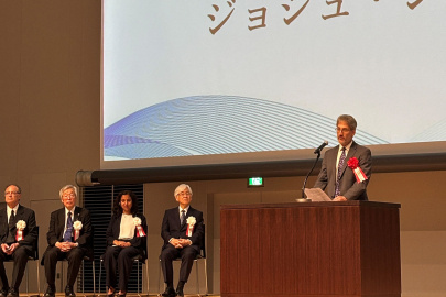 Dr. Josh Silverman delivers a message supporting the Radiation Effects Research Foundation at the Commemorative Ceremony of its 50th Anniversary in Nagasaki. Photo Credit: Cato M Milder 2025