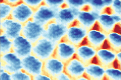 Image of a Wigner crystal captured by a high resolution ultra-low temperature scanning tunneling microscope. The periodic sites (blue) form a triangular structure with each consisting of exactly one electron separated by 40 billionths of a meter.