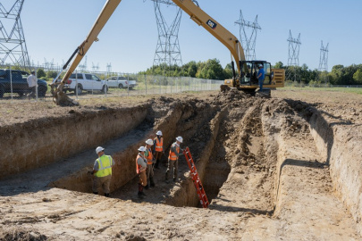 Workers conducting work inside a trench at the Paducah site