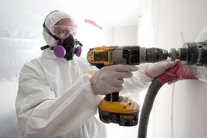 Image of worker weatherizing a wall