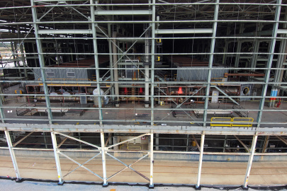 Open section of a large facility building with brightly colored valves at the Portsmouth Site